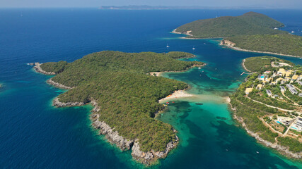 Aerial drone photo of limestone tropical exotic island bay with crystal clear turquoise sea visited by yachts and sail boats in popular paradise destination