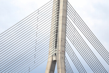 Close-up details of Latvia capital city Riga main large suspension bridge.