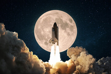 New space rocket with smoke and clouds takes off into the sky with full moon. Shuttle spaceship...