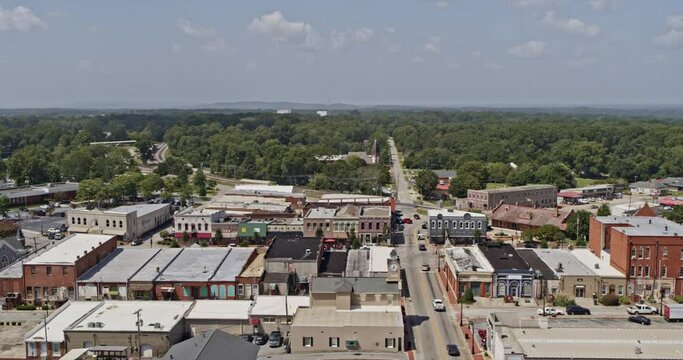 Barnesville Georgia Aerial v3 cinematic orbiting shot capturing downtown townscape with cars on the street driving pass building blocks - Shot with Inspire 2, X7 camera - September 2020