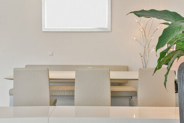 Modern dining room interior with furniture and panel