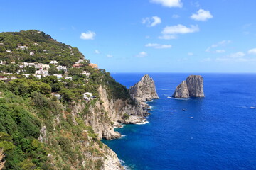 Fototapeta na wymiar panoramic view of the Capri coastline with Faraglioni rocks, Capri Island, Italy