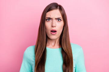 Photo of upset shocked young woman dressed turquoise t-shirt big eyes open mouth isolated pink...