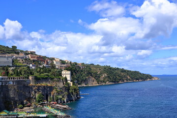 Fototapeta na wymiar Porto di Sorrento or Marina Piccola Harbor in Sorrento, Italy on the Coast of the Sorrentine Peninsula in Summer