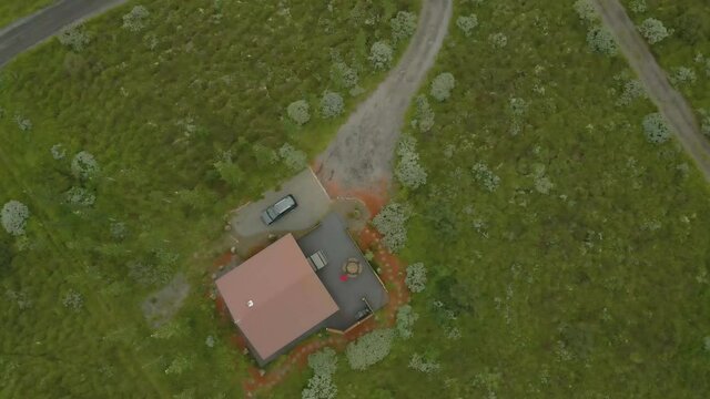 aerial drone view of the country side of southerner Iceland during the later summer months.  the beautiful greens landscape is filled with farms animals grazing on the pasture