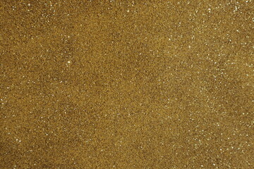 Fototapeta na wymiar Yellow surface with sequins, use for background.