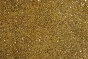 Yellow surface with sequins, use for background.