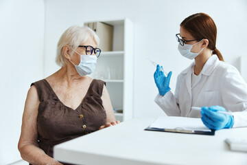 elderly woman patient in the hospital for vaccinations immunity protection