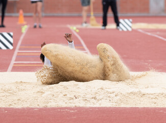 Long jumpers competing at a track and field meet