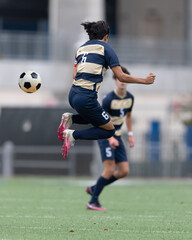 Obraz premium Athletic boys making exciting plays during a soccer game