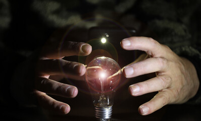 the man who wants to explain the increasing energy costs with a light bulb