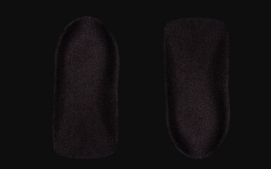 The orthopedic insole on a black background.