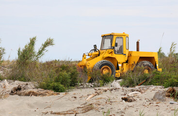 bulldozer on the sand during earthmoving activities on a construction site
