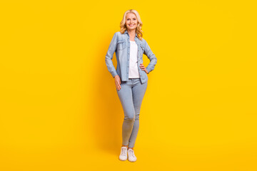 Fototapeta premium Full body photo of cheerful happy old woman wear casual clothes enjoy smile isolated on yellow color background