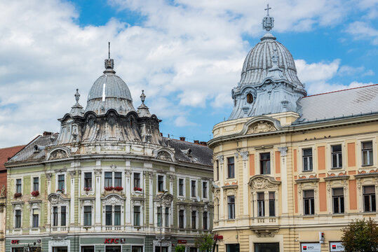 Cluj Napoca, Romania - July 8, 2016: Eclectic twin buildings on Iuliu Maniu Street in Cluj Napoca city