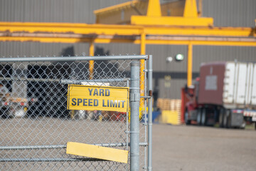 Safety sign on factory fence in industrial area