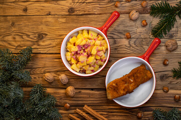 Traditional Christmas dinner in Czech Republic - carp fillet with potato salad