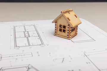 Wooden mini model of house on drawing