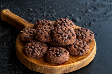 Chocolate chip cookies on dark background