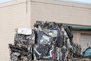 Compressed cubes of scrap metal at a junk yard.