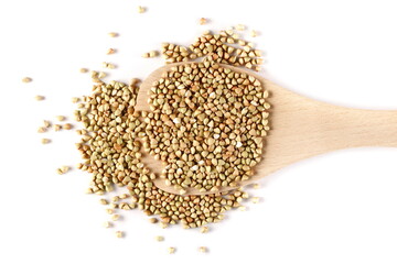 Peeled buckwheat seeds in wooden spoon isolated on white background, top view