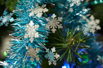 white snowflakes and blue garland. christmas decoration on christmas tree