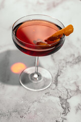 glass of boulevardier on black background