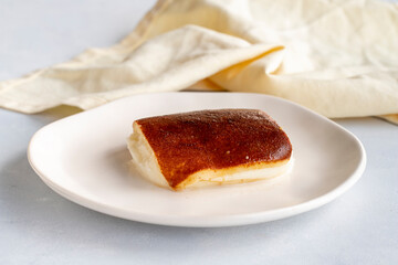 Fried milk dessert on a white background. Turkish dessert kazandibi
