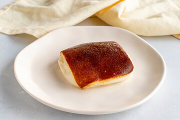 Fried milk dessert on a white background. Turkish dessert kazandibi