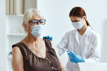 elderly woman patient in the hospital for vaccinations covid-19 passport
