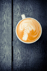 cup of coffee on a wooden table