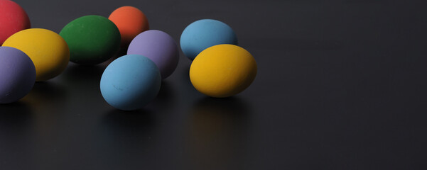 Easter eggs or color egg. Multi-colorful of easter eggs on background in studio with close-up shot which include many colour such as yellow, green, blue, purple, red on festival eggs by art painting.