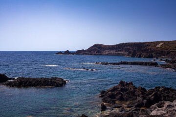 View of the scenic lava rock cliff  in the Linosa island.