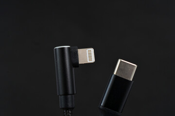 USB-c and Lightning iphone cable focus on lightning connector