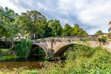 Fototapeta na wymiar A view towards the Knaresborough Low Bridge in Yorkshire, UK in summertime
