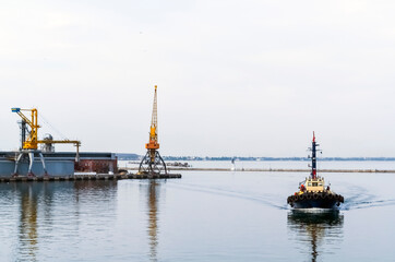 On a September evening, a ship sailing into port