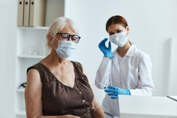 elderly woman patient in the hospital for vaccinations vaccine passport