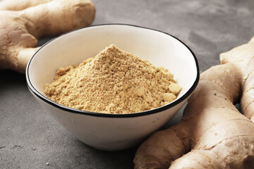 Fresh ginger root, ground ginger spice in a bowl, for article, winter immunity, healthy medicine,...