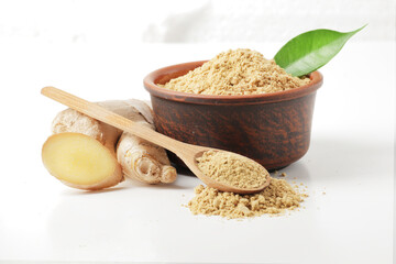 Dry and fresh ginger in bowl isolated on white background