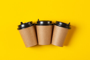  blank gray paper cups with a plastic black lid