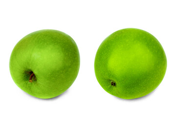 A green apple in close-up isolated on a white background.
