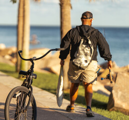 person riding a bicycle fisherman fish