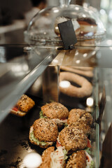 Details from modern bakery. Different delicious bakery products on shelf's.