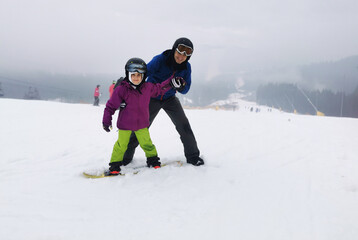 snowboard lesson in winter resort