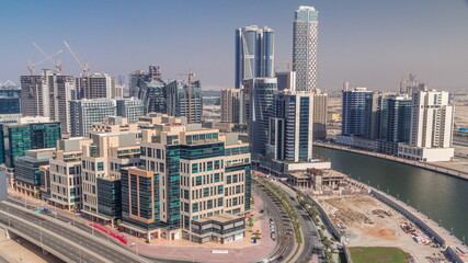 Fototapeta na wymiar Bay Square district timelapse with mixed use and low rise complex office buildings located in Business Bay in Dubai