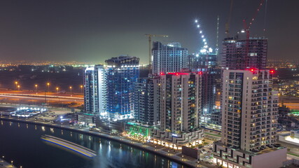 Towers at the Business Bay aerial all night timelapse in Dubai, United Arab Emirates