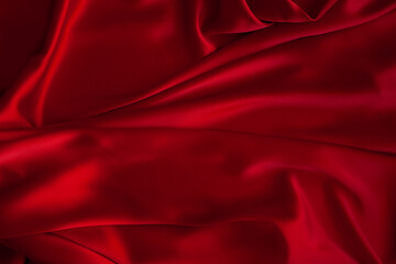 Obraz premium Red fabric texture background. Silk satin folds