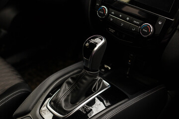Gear shift handle in a modern car, closeup photo
