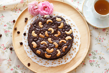 Top​ view​ chocolate cake on a plate.