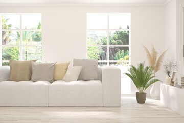 Fototapeta premium Stylish room in white color with sofa and summer landscape in window. Scandinavian interior design. 3D illustration